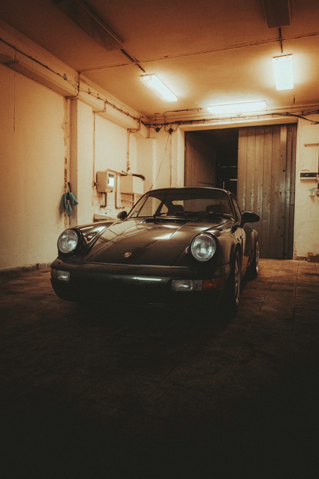 Private collection of classic cars inside a dim atmospheric garage